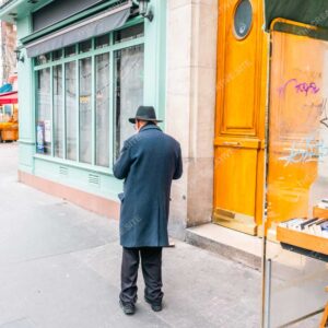 Parisian Gentleman Standing By The Yellow Facade