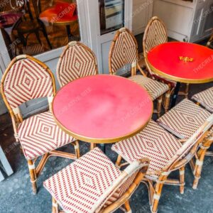 Red Parisian Café Tables And Patterned Chairs