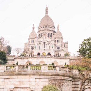 Person In Orange Coat Facing Sacre Coeur Gates