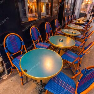 Evening Paris Café With Blue Wicker Chairs