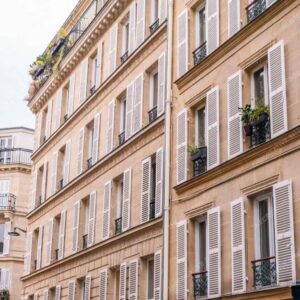 Parisian Shuttered Facades With Balconies And Plants