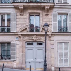 Classic Parisian Stone Facade With Ornate Balcony