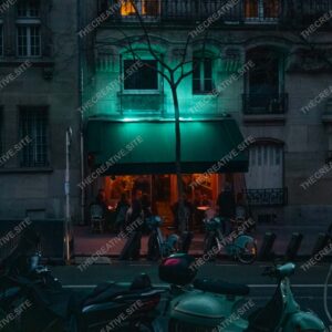 Neon Lit Parisian Café At Night With Scooters