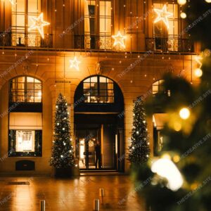 Parisian Building Adorned With Christmas Lights And Trees