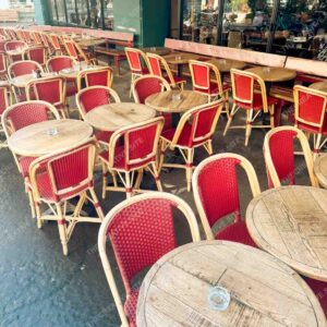 Classic Paris Café Terrace With Red Wicker Chairs