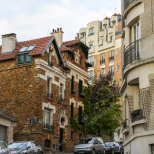 Calm Parisian Street with Parked Cars and Classic Buildings